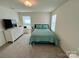 Bedroom with queen bed, dresser, and view of pool at 11005 Woodland Creek Way, Charlotte, NC 28262