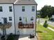 Private deck with seating area and umbrella at 11005 Woodland Creek Way, Charlotte, NC 28262