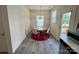 Bright dining area with table, chairs, and stylish rug at 11005 Woodland Creek Way, Charlotte, NC 28262