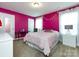 Bedroom with pink walls and a queen bed at 11021 Ogden Ln, Charlotte, NC 28278