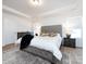 Bright bedroom with a tufted headboard bed and plenty of natural light at 11021 Ogden Ln, Charlotte, NC 28278