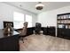 Home office with built-in desk and bookcases at 11021 Ogden Ln, Charlotte, NC 28278