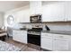 Modern kitchen with stainless steel appliances and granite countertops at 11021 Ogden Ln, Charlotte, NC 28278