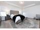 Main bedroom with tufted headboard, nightstands, and rug at 11021 Ogden Ln, Charlotte, NC 28278