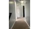 Hallway featuring neutral carpeting and freshly painted walls at 11124 Northwoods Forest Dr, Charlotte, NC 28214