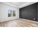 Bright bedroom with dark accent wall and hardwood floors at 113 Brentwood Dr, Maiden, NC 28650