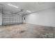 Attached garage with overhead door and concrete floor at 113 Brentwood Dr, Maiden, NC 28650