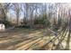 Large backyard with a grassy area and a swing set at 1224 Castlegate St, Gastonia, NC 28054