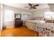 Light and airy bedroom with hardwood floors, featuring a metal bed frame and antique furniture at 1224 Castlegate St, Gastonia, NC 28054