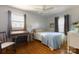 Cozy bedroom with hardwood floors, window seating, and a desk at 1224 Castlegate St, Gastonia, NC 28054