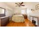 Charming bedroom with hardwood floors, a metal bed frame, and antique dresser at 1224 Castlegate St, Gastonia, NC 28054