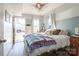 Bright bedroom with a queen bed and exterior access showcasing backyard view at 1224 Castlegate St, Gastonia, NC 28054