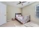 Neutral bedroom features a ceiling fan and charming decor at 12338 Shadow Ridge Ln, Charlotte, NC 28273