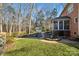 Landscaped backyard with shed and brick patio at 12710 Winding Ridge Rd, Huntersville, NC 28078