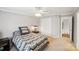 Well-lit bedroom with a double bed and access to hallway at 12710 Winding Ridge Rd, Huntersville, NC 28078