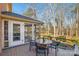 Spacious deck with table and chairs, overlooking wooded area at 12710 Winding Ridge Rd, Huntersville, NC 28078