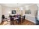 Formal dining room with hardwood floors and large windows at 12710 Winding Ridge Rd, Huntersville, NC 28078