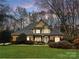 Brick house with a two-car garage and manicured lawn at 12710 Winding Ridge Rd, Huntersville, NC 28078