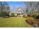 Two-story house with a front yard and mature trees at 12710 Winding Ridge Rd, Huntersville, NC 28078