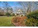 Two-story house with a front yard and landscaping at 12710 Winding Ridge Rd, Huntersville, NC 28078