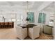 Elegant dining area with a round table and contemporary light fixture at 130 Cherokee Rd # 403, Charlotte, NC 28207