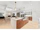 Modern kitchen island with breakfast bar, looking into living room at 130 Cherokee Rd # 403, Charlotte, NC 28207