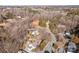 Aerial view showing home's location in a wooded neighborhood at 1325 Bostwood Ln, Concord, NC 28025