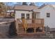 Backyard with deck and stairs leading down at 1325 Bostwood Ln, Concord, NC 28025