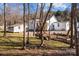 House with backyard, shed, and wooded area at 1325 Bostwood Ln, Concord, NC 28025