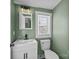 Clean bathroom with white vanity, toilet and window at 1325 Bostwood Ln, Concord, NC 28025