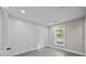 Cozy bedroom with hardwood floors and white board and batten walls at 1325 Bostwood Ln, Concord, NC 28025