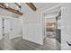 Bright entryway with wood beams, wainscoting and hardwood floors at 1325 Bostwood Ln, Concord, NC 28025