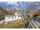 White house exterior with landscaping and a paved driveway at 1325 Bostwood Ln, Concord, NC 28025