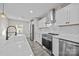 Modern kitchen with white cabinets, quartz countertops and stainless steel appliances at 1325 Bostwood Ln, Concord, NC 28025