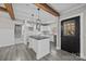 Modern kitchen with white cabinets, granite countertops, and a kitchen island at 1325 Bostwood Ln, Concord, NC 28025