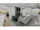 Living room with modern fireplace and comfortable seating area at 1325 Bostwood Ln, Concord, NC 28025