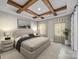 Main bedroom with wood beam ceiling and a large bed at 1325 Bostwood Ln, Concord, NC 28025