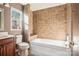 Bathroom with tub, shower, and tile surround at 14264 Maple Hollow Ln, Mint Hill, NC 28227