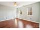 Bright bedroom with hardwood floors and two windows at 14264 Maple Hollow Ln, Mint Hill, NC 28227