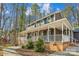 Two-story house with wraparound porch and landscaped yard at 14264 Maple Hollow Ln, Mint Hill, NC 28227