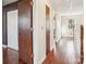 Upstairs hallway with wood floors and access to bedrooms at 14264 Maple Hollow Ln, Mint Hill, NC 28227