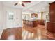 Kitchen with island, hardwood floors, and dark wood cabinets at 14264 Maple Hollow Ln, Mint Hill, NC 28227