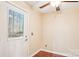 Bright laundry room with wood flooring and exterior access at 14264 Maple Hollow Ln, Mint Hill, NC 28227