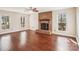 Living room with brick fireplace and hardwood floors at 14264 Maple Hollow Ln, Mint Hill, NC 28227