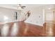 Spacious living room with hardwood floors and staircase at 14264 Maple Hollow Ln, Mint Hill, NC 28227