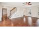 Spacious living room with hardwood floors and a staircase at 14264 Maple Hollow Ln, Mint Hill, NC 28227