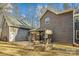 Stone patio with fire pit and pergola next to house at 14264 Maple Hollow Ln, Mint Hill, NC 28227