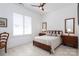 Bright bedroom with a queen bed, wooden furniture, and window shutters at 14310 Cameryn Elise Dr, Cornelius, NC 28031