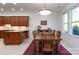 Kitchen dining area with wood table and chairs, hardwood floors at 14310 Cameryn Elise Dr, Cornelius, NC 28031