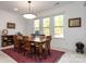 Bright dining room featuring hardwood floors and large windows at 14310 Cameryn Elise Dr, Cornelius, NC 28031